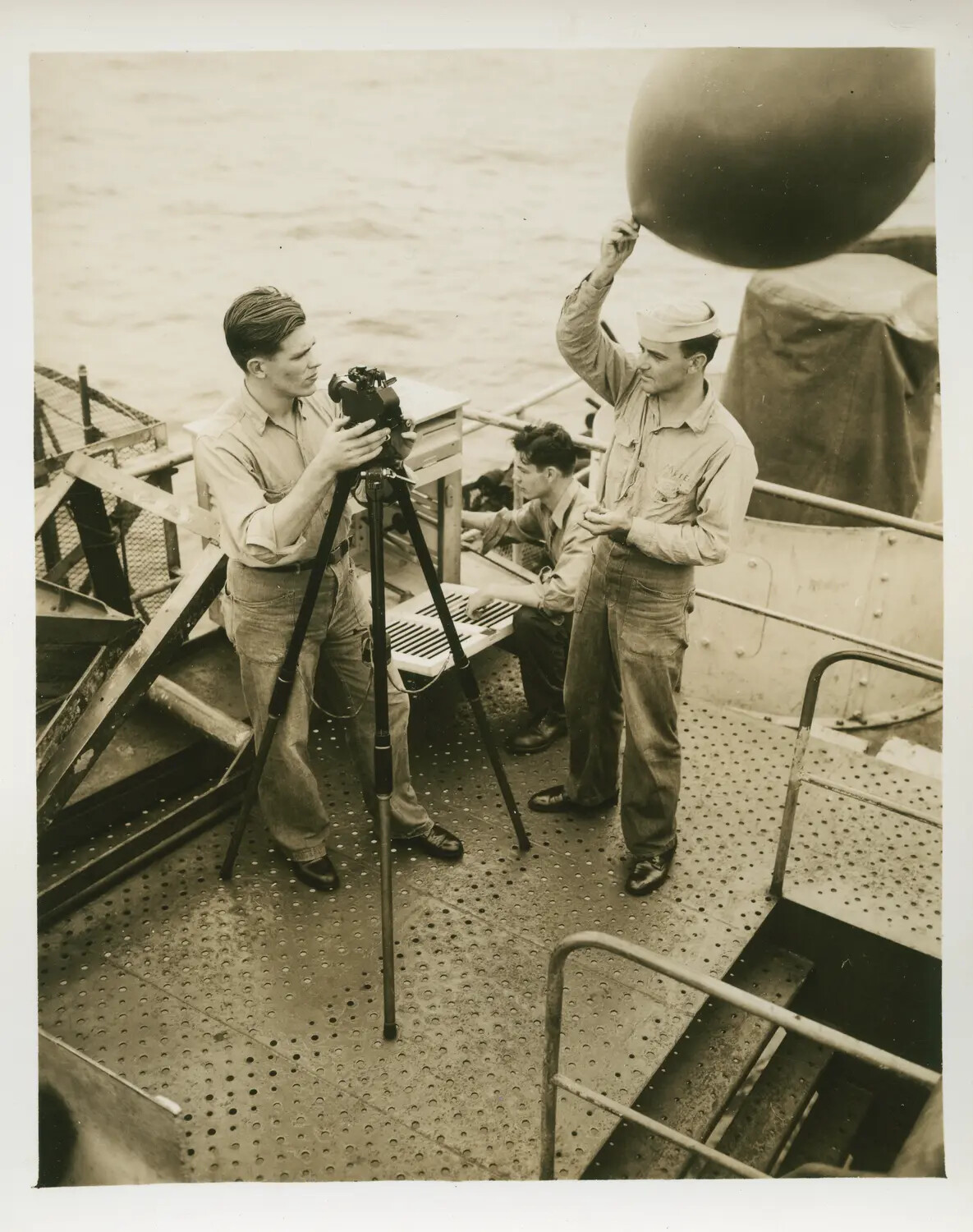 Navy Sailors Conducting Weather Balloon Observation Aboard USS Petrof Bay (CVE-80), WWII