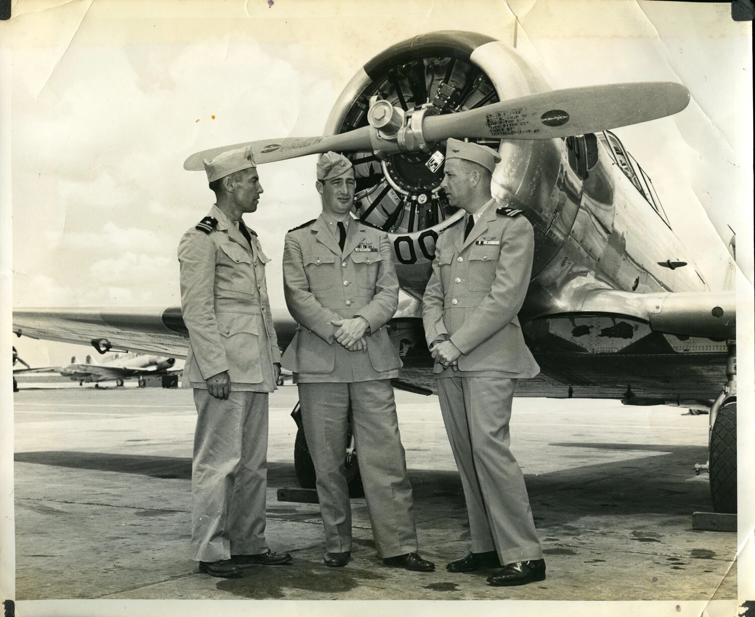 Three U.S. Navy Officers Beside Radial-Engine Aircraft, Naval Air Station Flight Line