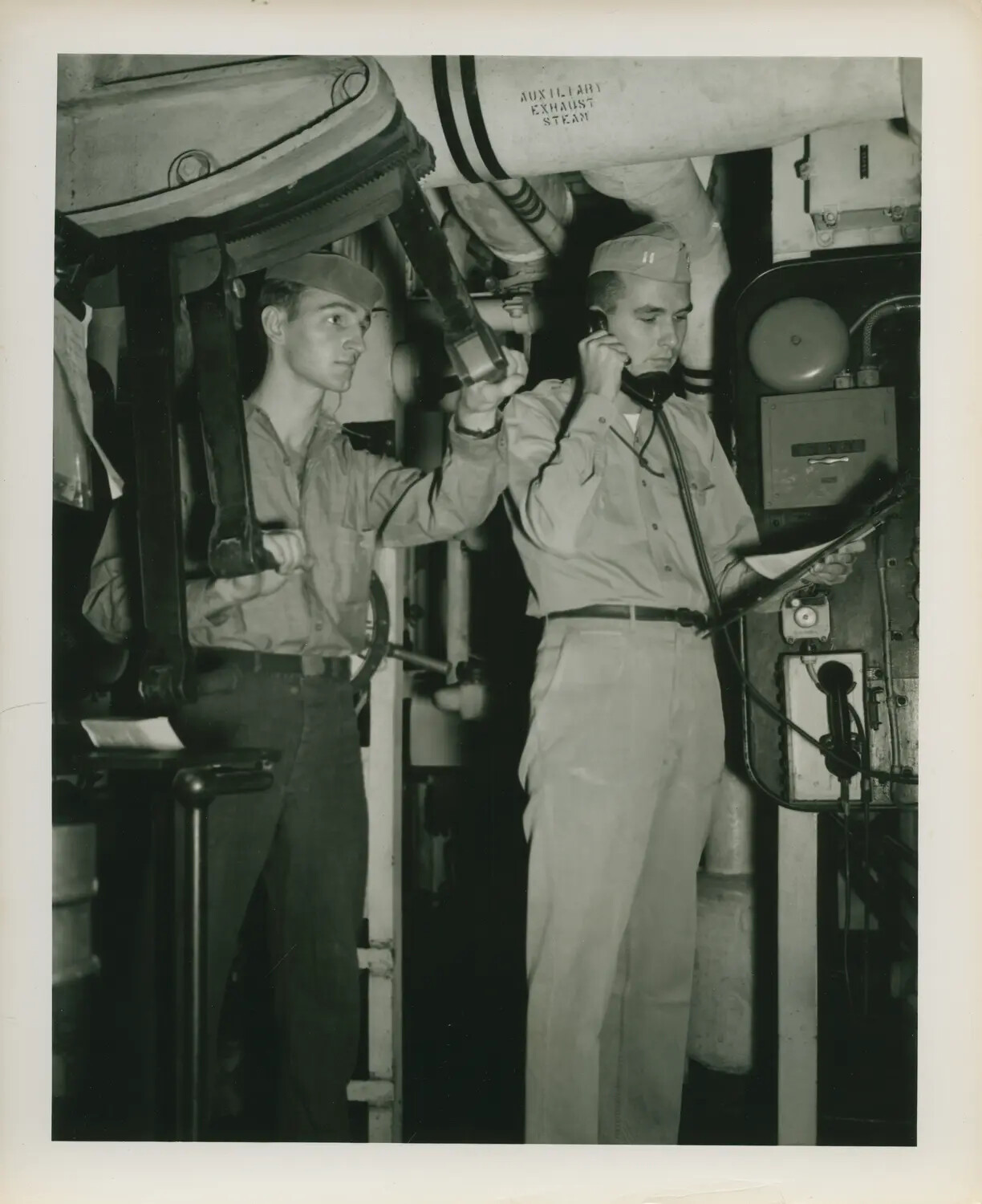 U.S. Navy Sailors at a Below-Decks Steering/Control Station, USS Petrof Bay (CVE-80), WWII