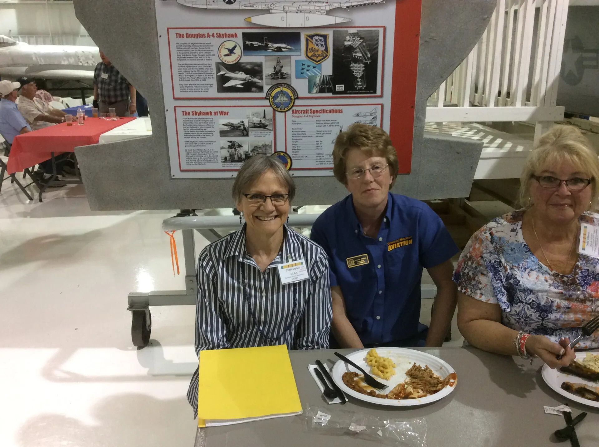 Reunion Attendees Seated Beneath A-4 Skyhawk Exhibit, Tennessee Museum of Aviation