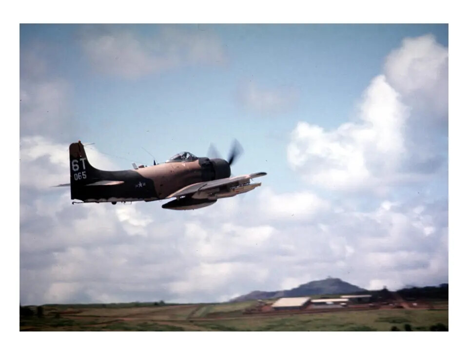 A-1 Skyraider (Tail Code 6T-065) in Flight Near Airfield, Vietnam War Era