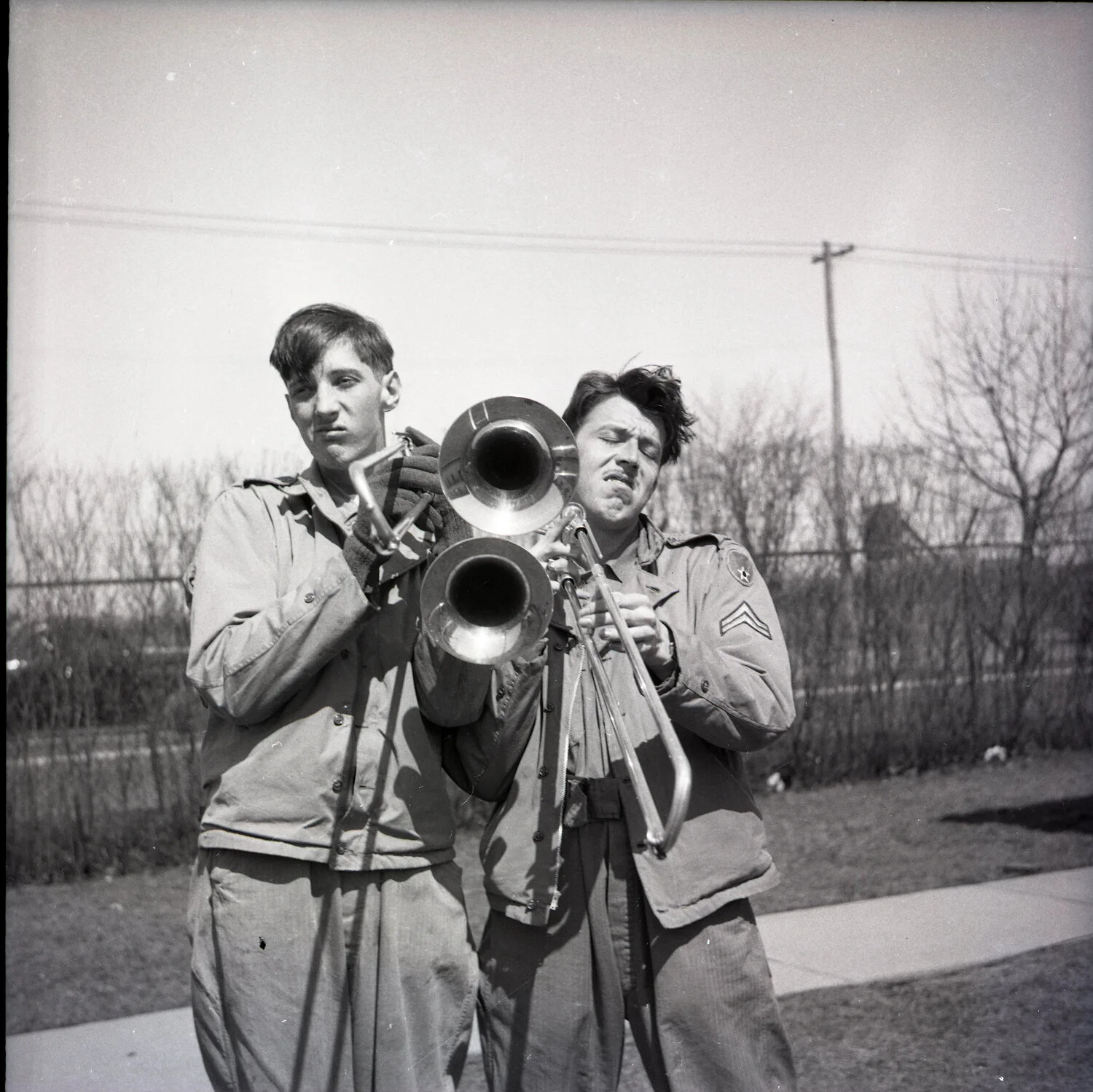 Two Servicemen with Double-Bell Trombone, Military Base, Winter