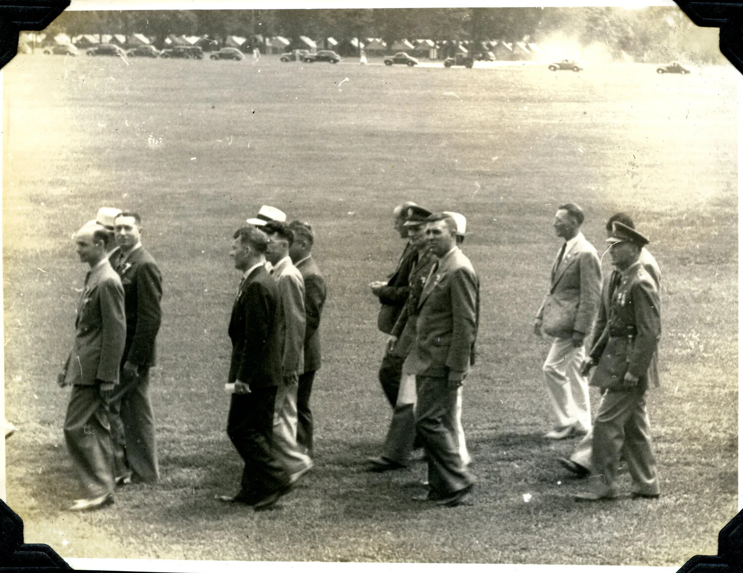 Procession of Civilian-Dressed Officials and Military Officer Crossing Parade Field, Army Post (Jervey Signal Corps Album)