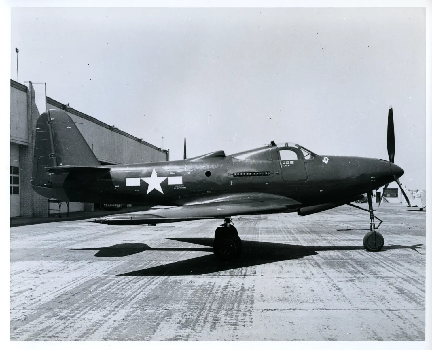 Bell P-63 Kingcobra Fighter Aircraft on Ramp, World War II