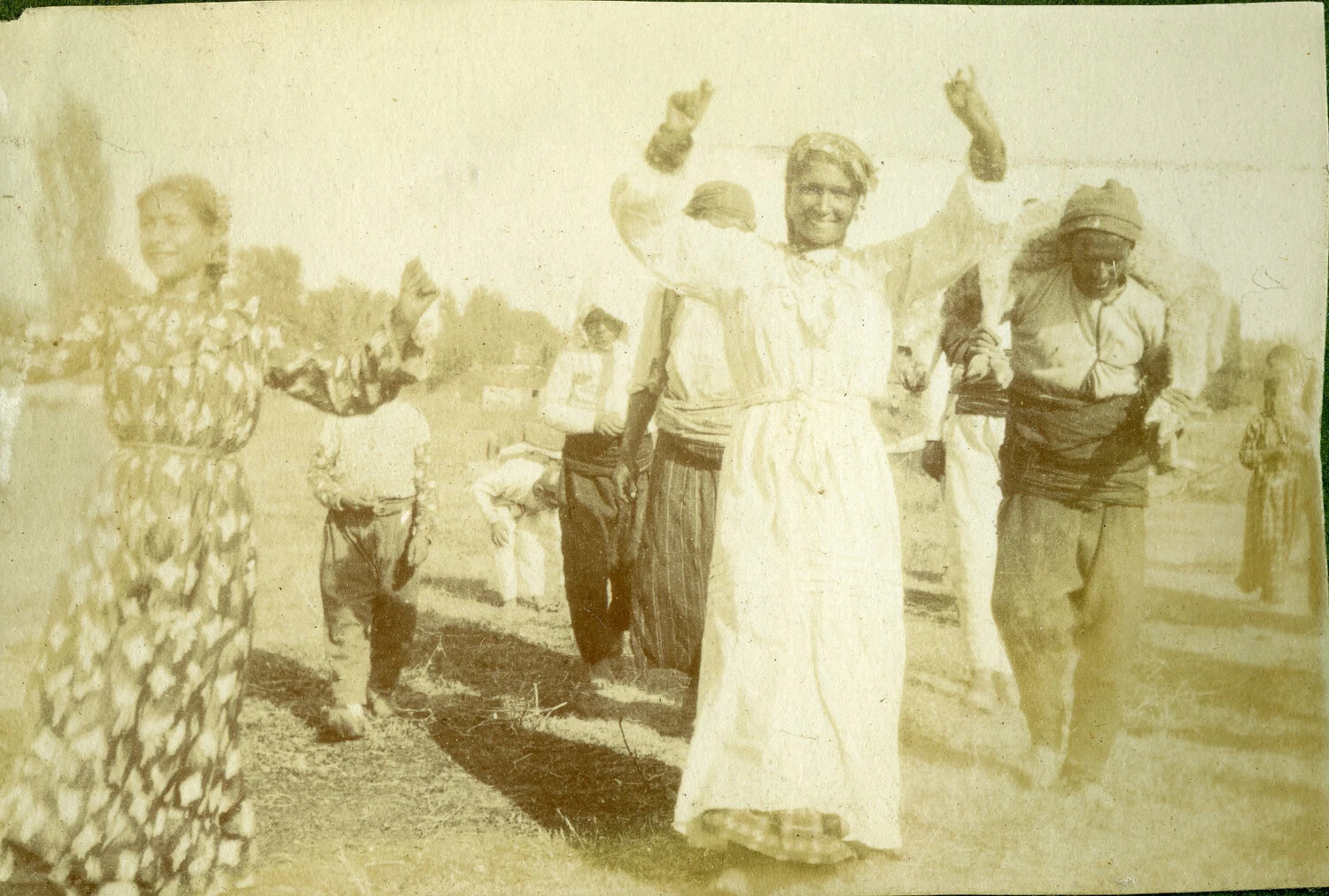 Villagers in Traditional Dress Celebrating Outdoors, WWI French Pilot Album