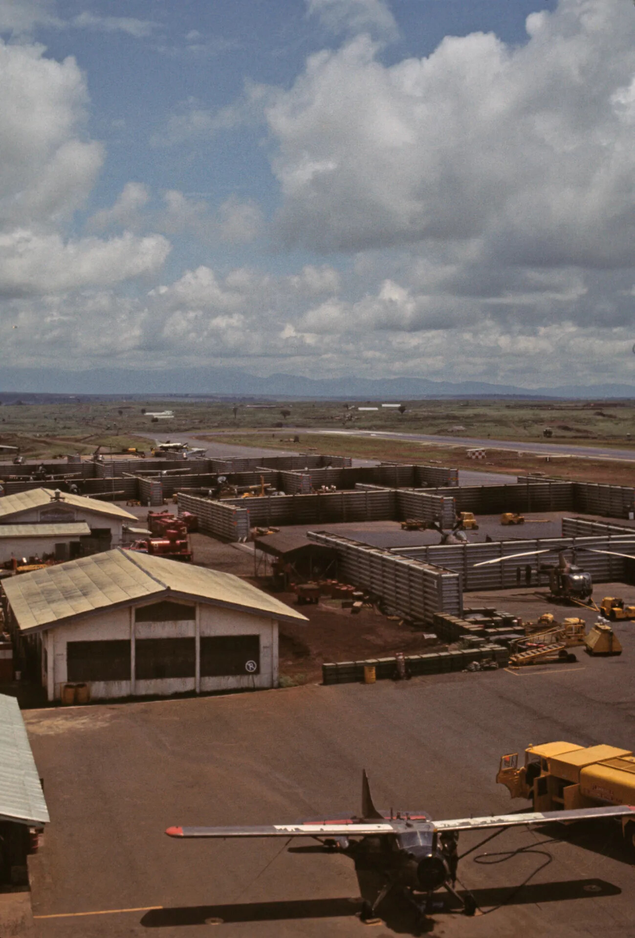 Elevated View of Vietnam-Era Airbase with Aircraft Revetments and Flight Line