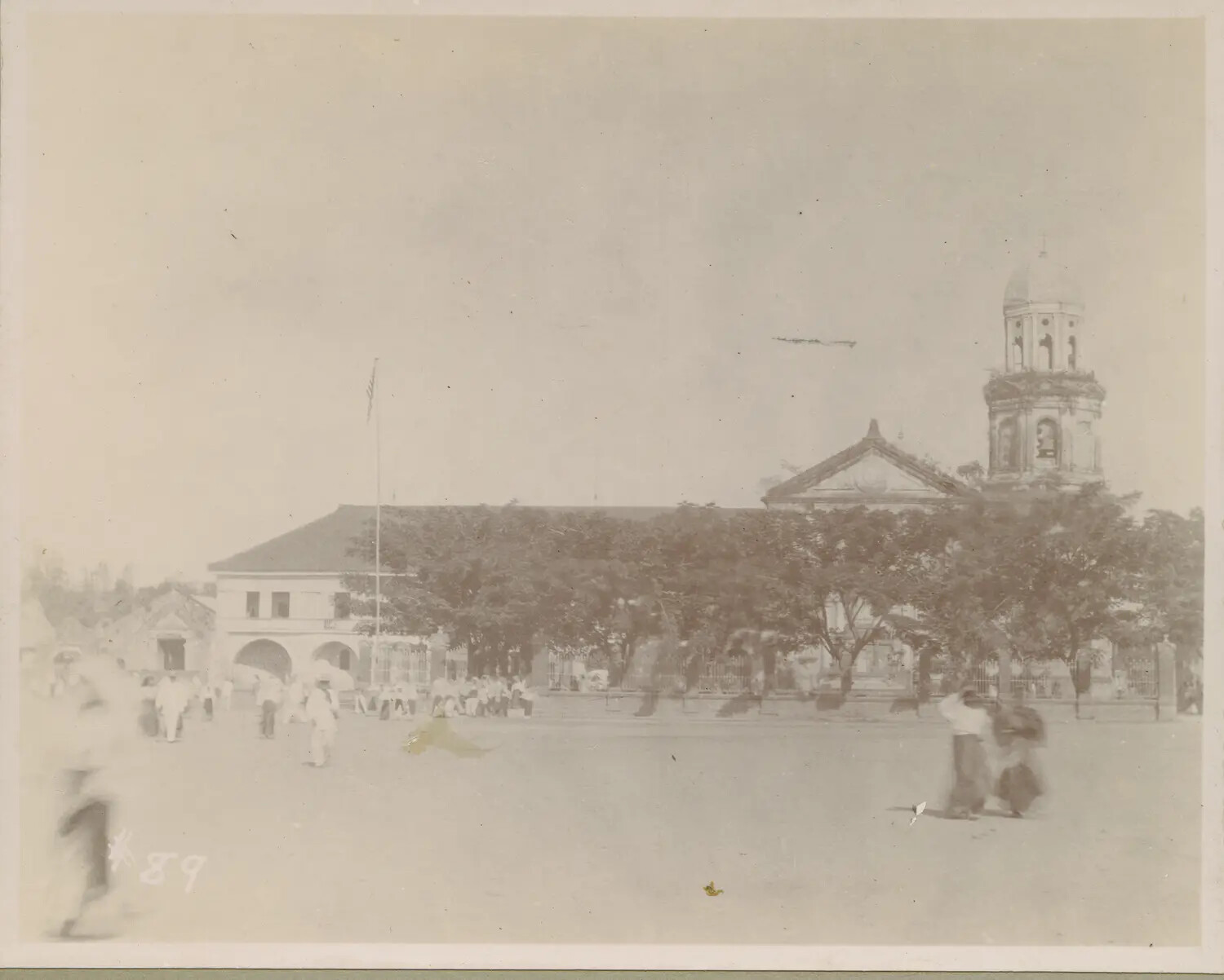 Town Plaza with Spanish Colonial Church and American Flag, Philippines, c. 1899-1905