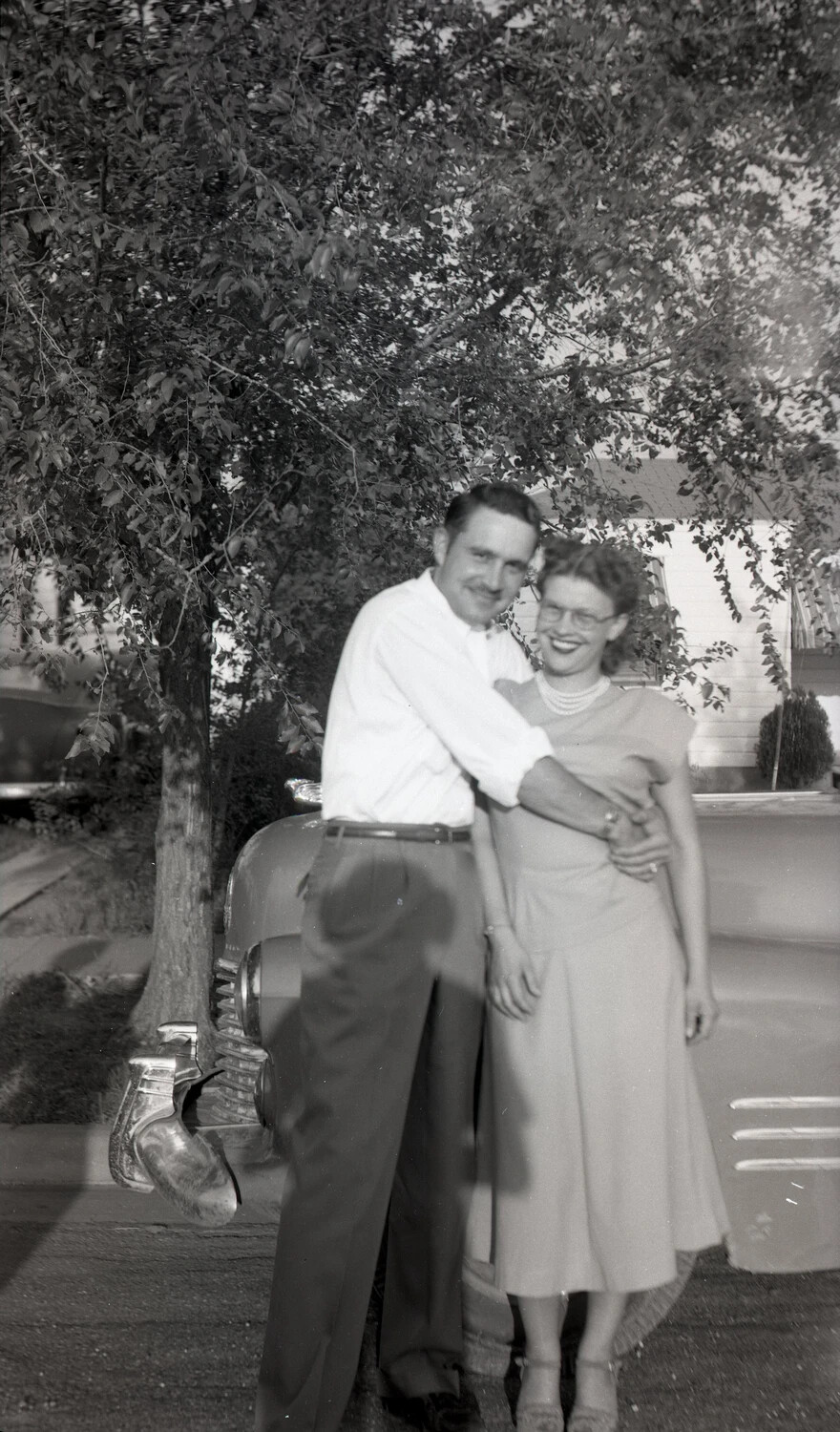 Man and Woman Embracing Beside Automobile, Kelley Family Album
