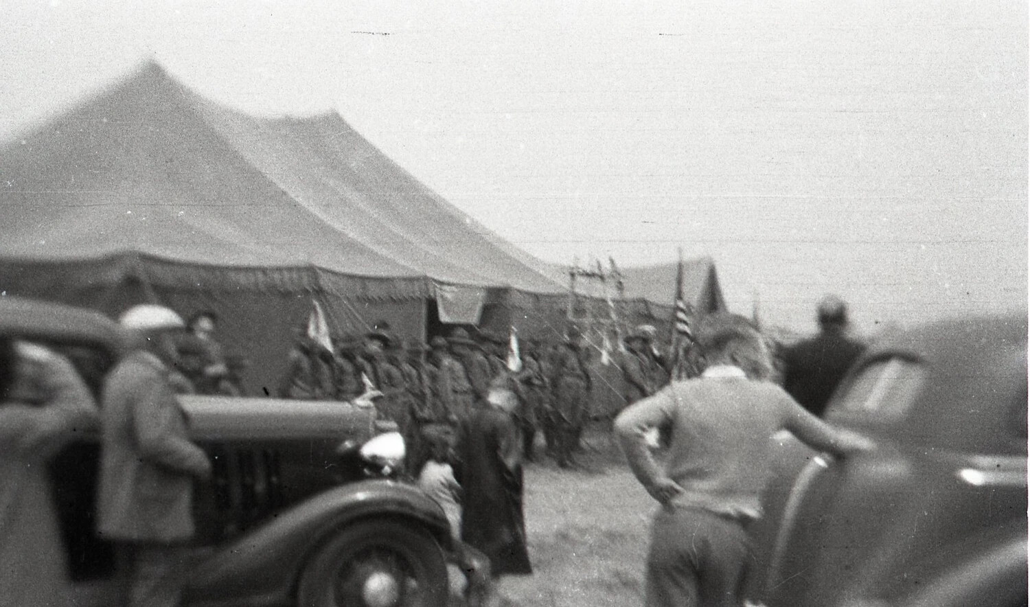 Encampment Scene with Tents, American Flag, and Parked Automobiles, Alternate View, State-Side, WWII Era