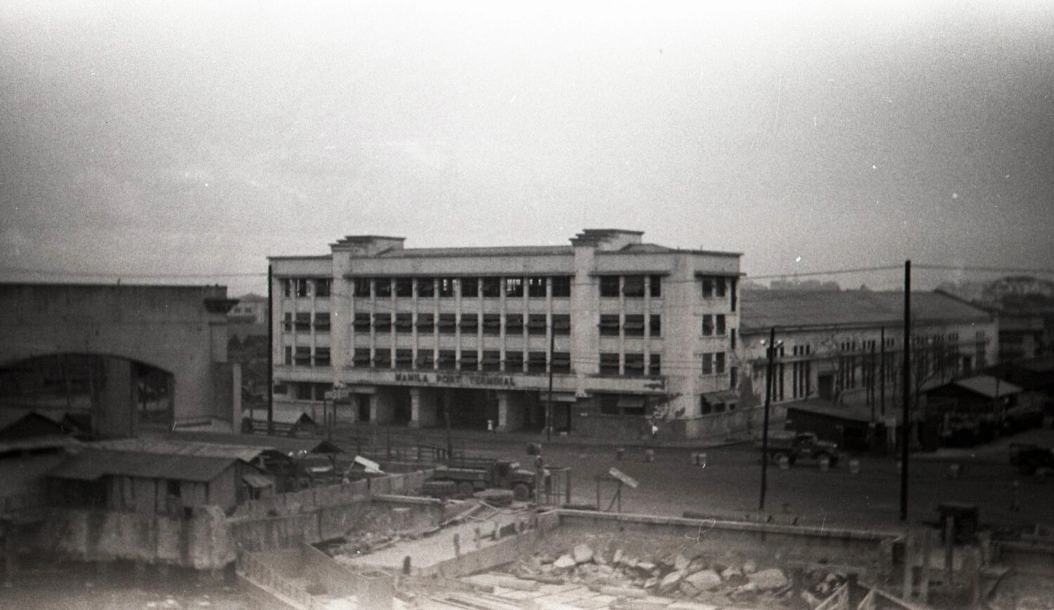 Manila Port Terminal Building with War Damage and U.S. Military Trucks, Philippines WWII
