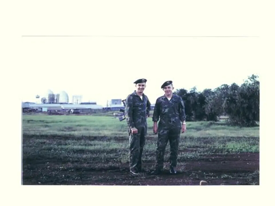 Two Servicemen in Camouflage Fatigues and Berets Beside Radome Installation