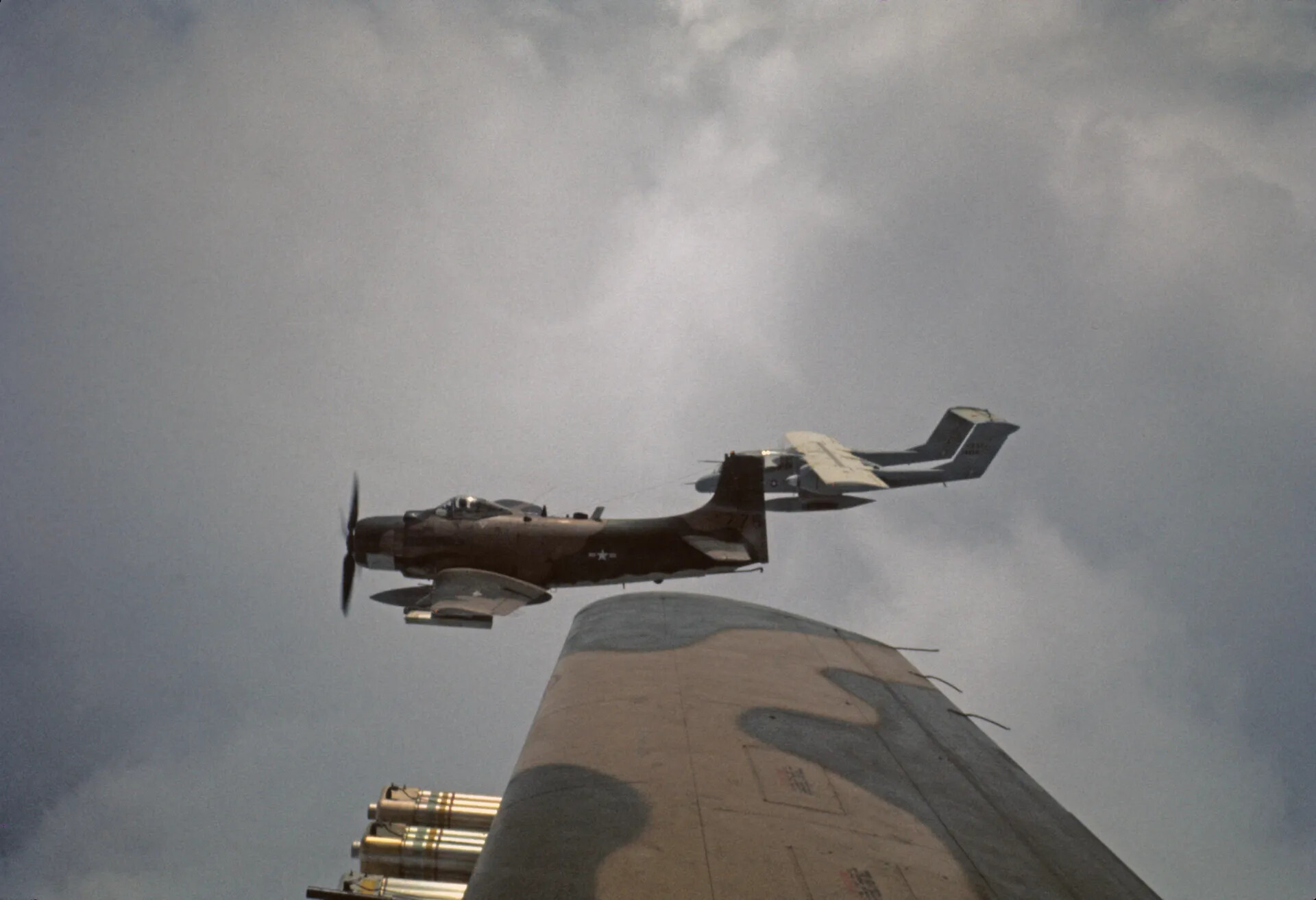 Two Douglas A-1 Skyraiders in Close Formation Flight, Underside View