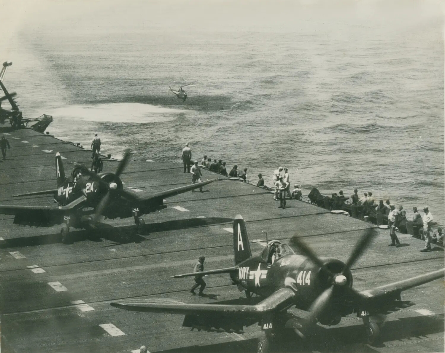 F4U/AU-1 Corsairs on Carrier Flight Deck with Plane Guard Helicopter, Korean War Era