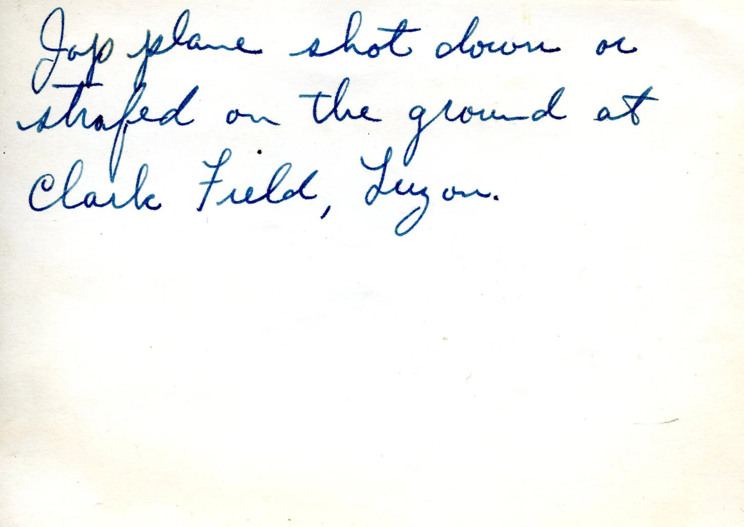 Handwritten Caption: 'Jap Plane Shot Down or Strafed on the Ground at Clark Field, Luzon'