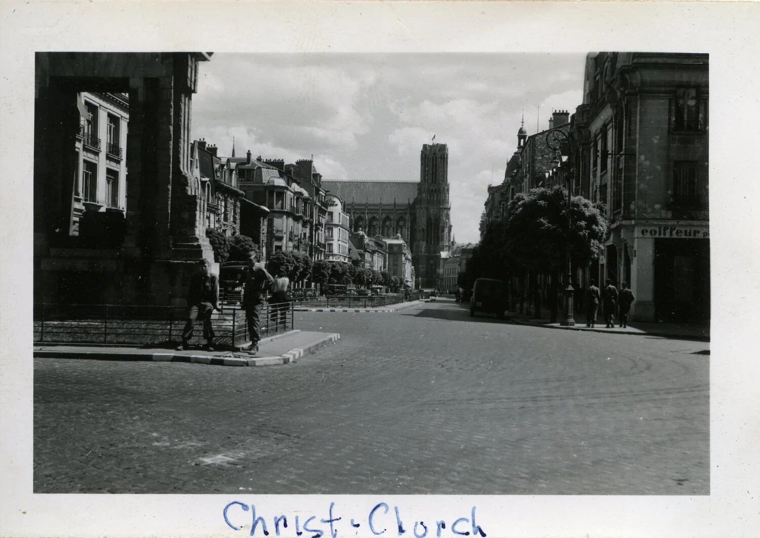 American Soldiers on European City Street with Gothic Cathedral in Background, 44th Infantry Division, WWII France