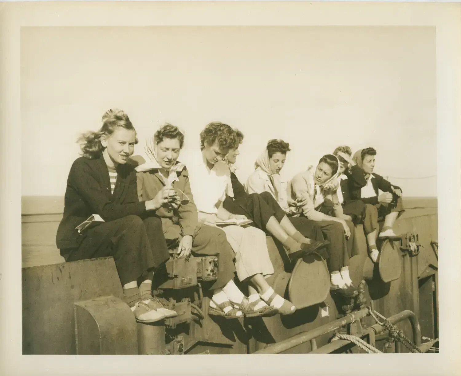 Civilian Women Seated Aboard USS Petrof Bay (CVE-80), WWII Era