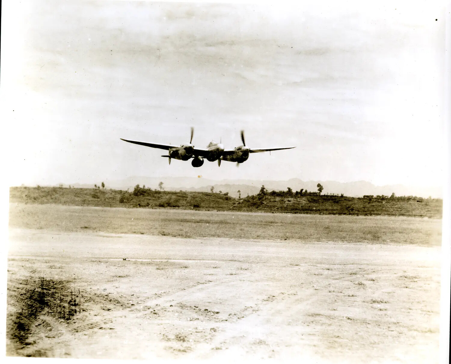 Lockheed P-38 Lightning Taking Off from Airstrip, China-Burma-India Theater, WWII