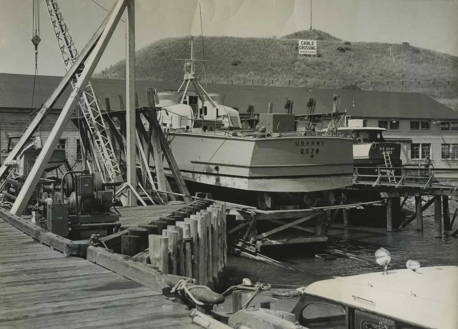 U.S. Army Small Craft Hauled Out for Repair at a Marine Railway Boatyard, World War II Era