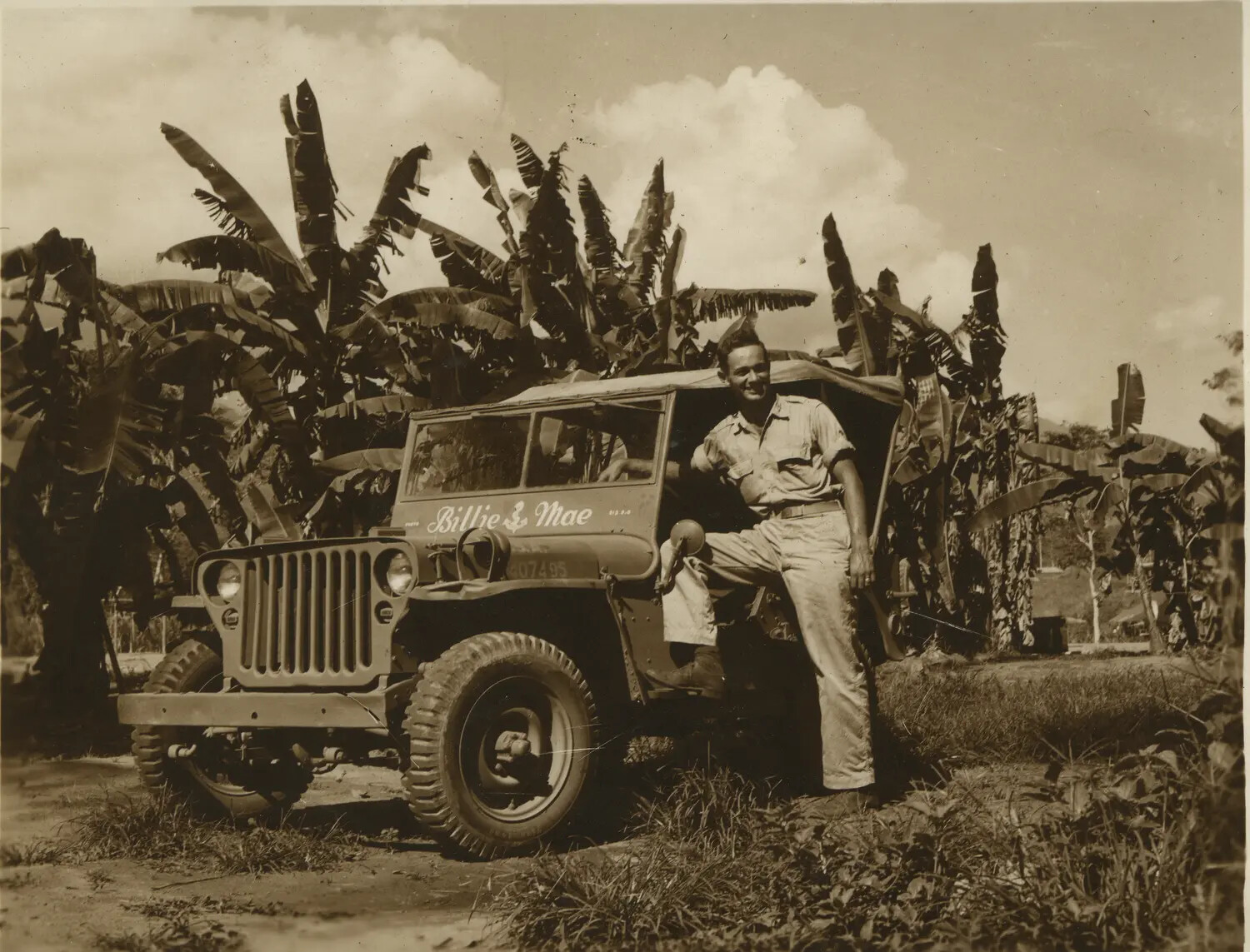 Serviceman Posing with Jeep 'Billie Mae,' 312th Bomb Group Area of Operations