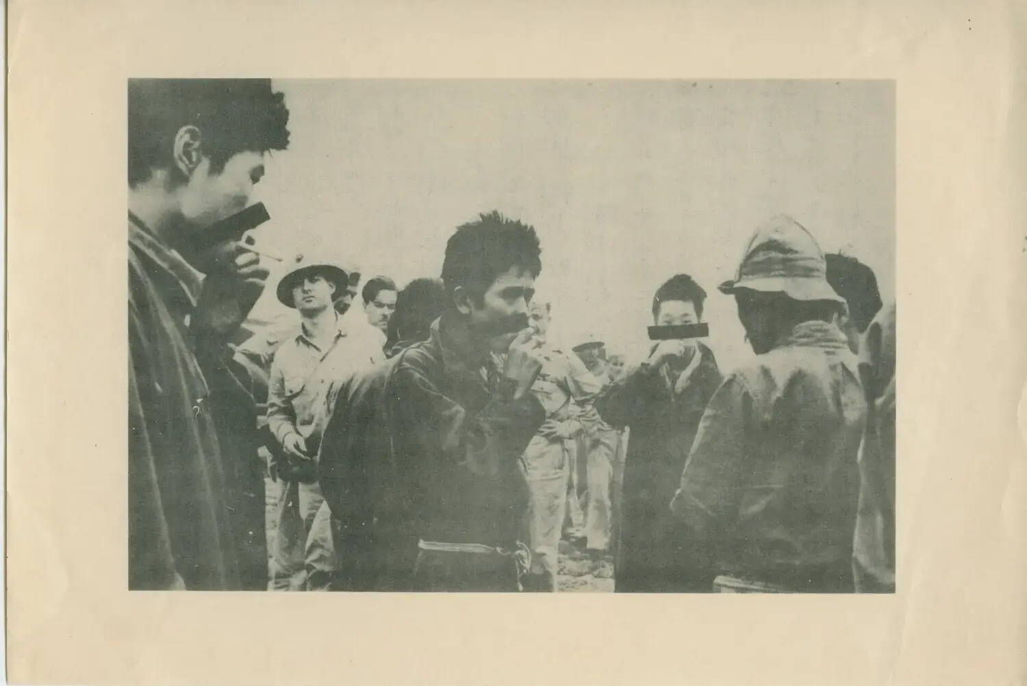 Press Photograph: Group of Men on Deck, One Face Censored