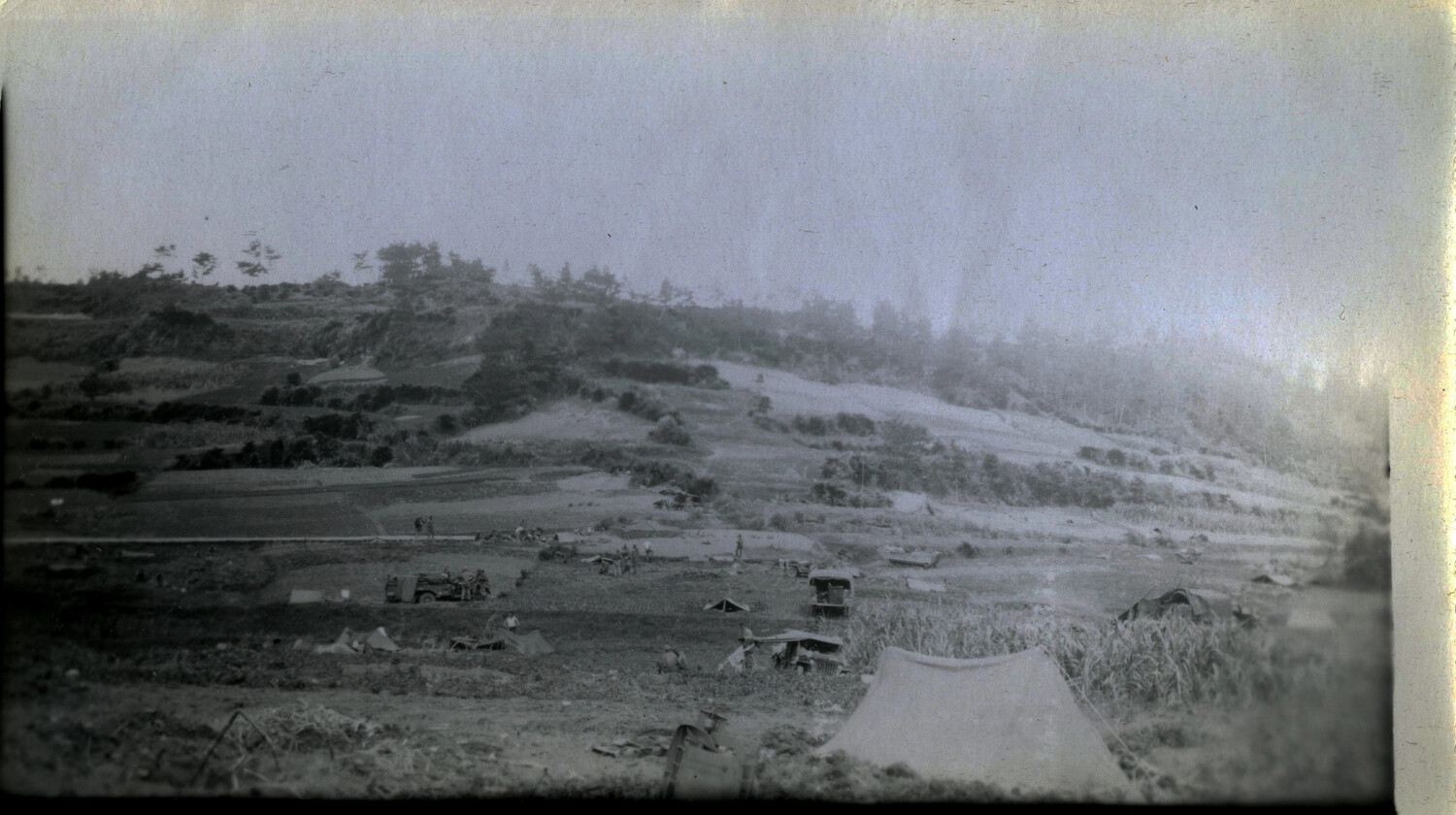 U.S. Military Bivouac in Terraced Hillside Terrain, Likely Okinawa, 1945