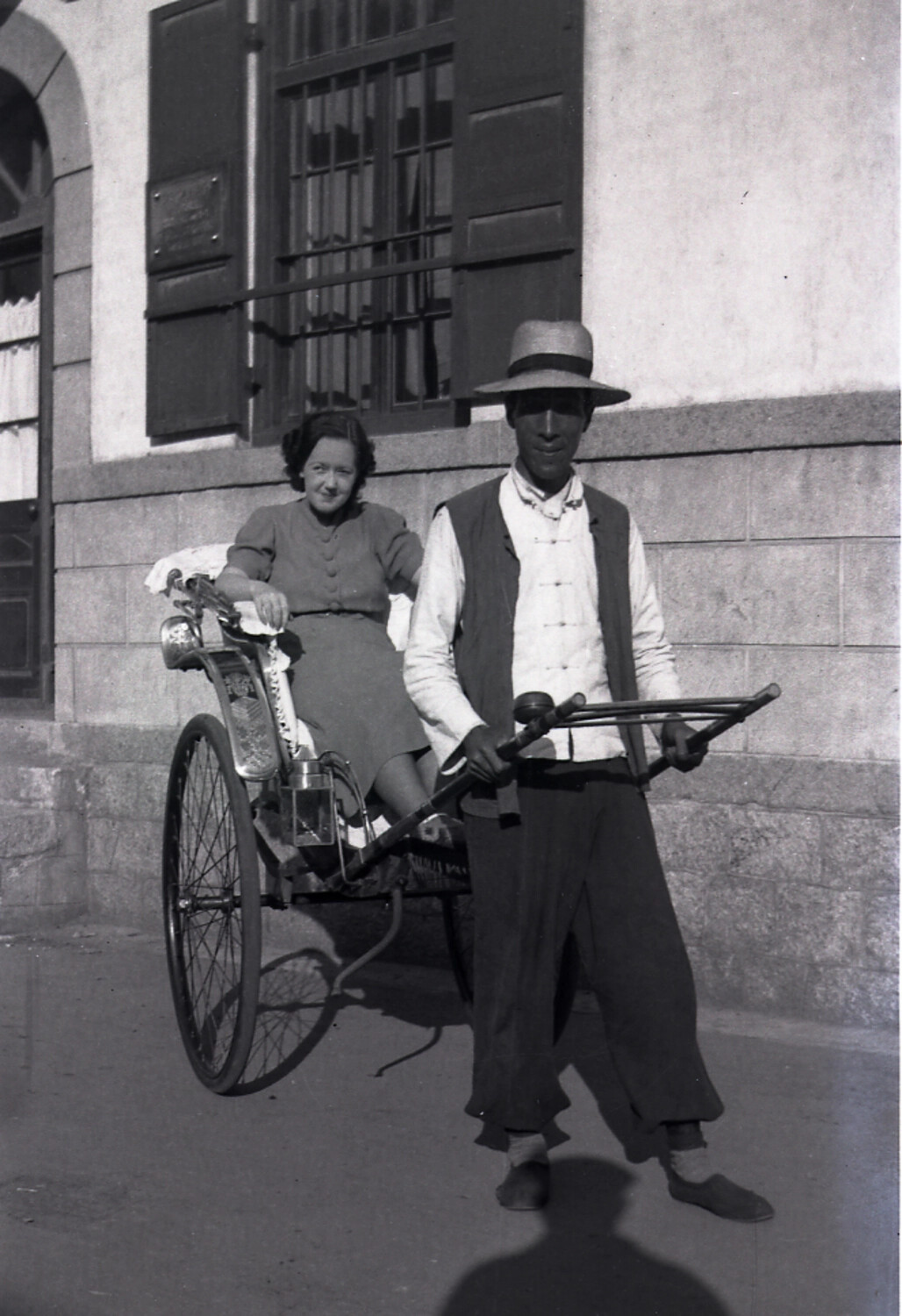 Western Woman Riding in a Rickshaw with Chinese Puller, Treaty Port China