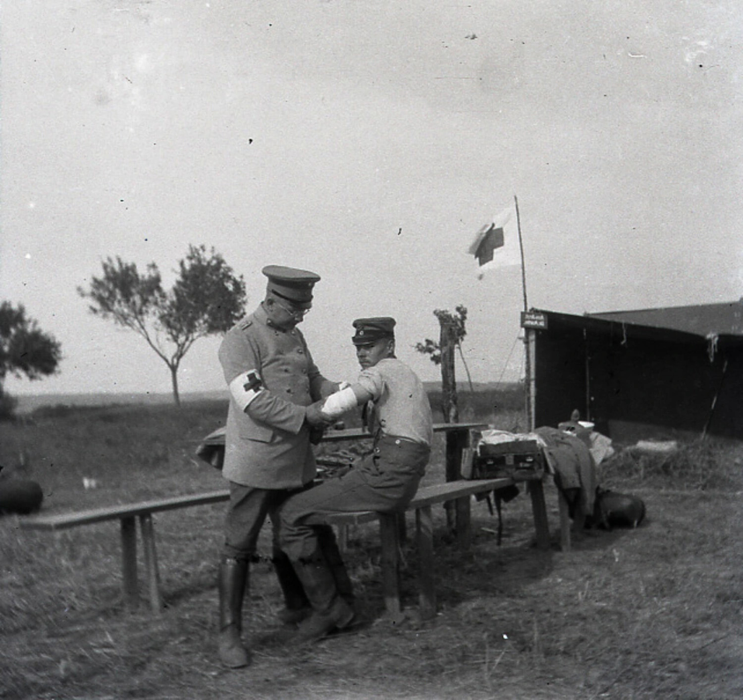 German Field Dressing Station with Red Cross Medical Officer Treating Soldier, World War I