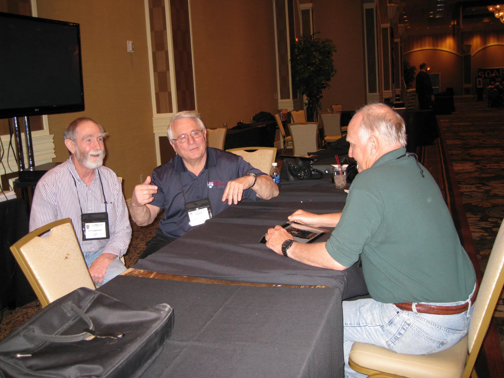Don Engebretsen and Attendees Working at a Banquet Table, Special Operations Association Reunion XXXVII, Las Vegas, 2013