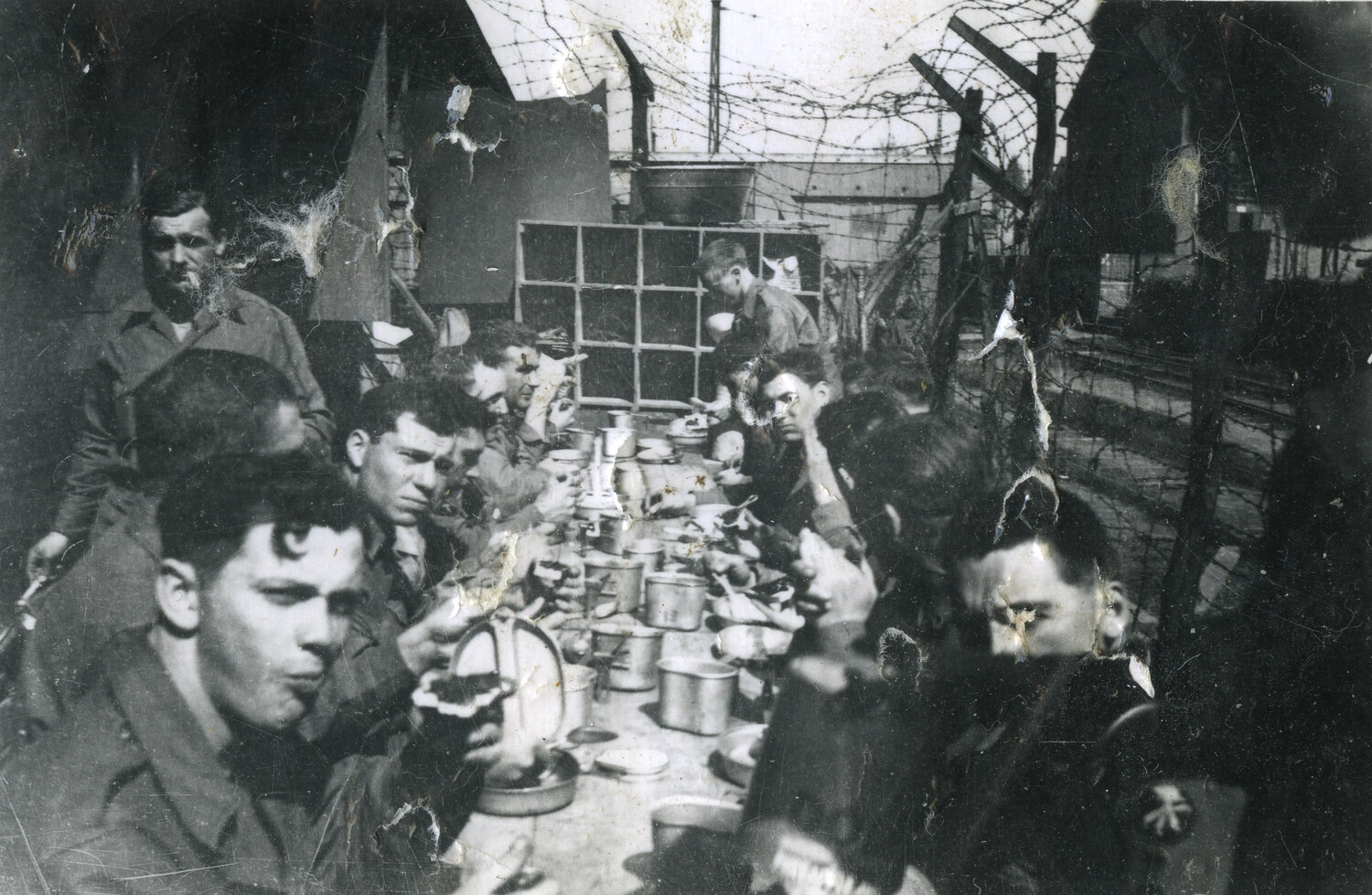 Soldiers Eating at Outdoor Mess Table Behind Barbed Wire, 101st Airborne Collection