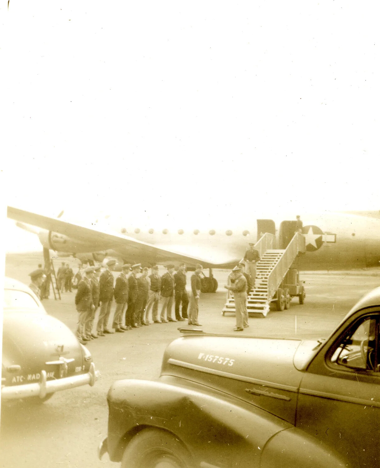 Military Reception Line and Transport Aircraft, Kessler Field, 1946
