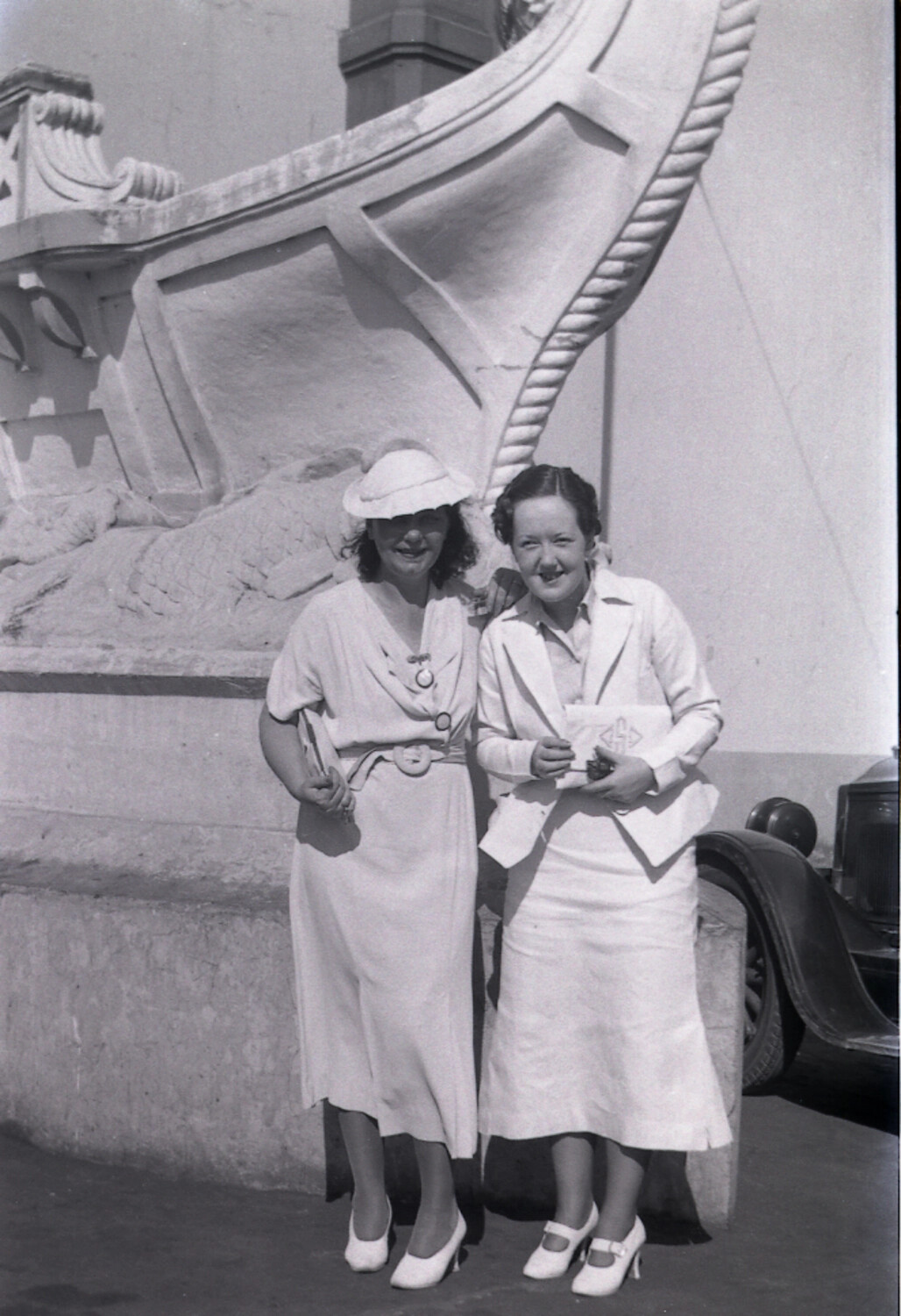 Two Women at an Ornamental Ship's-Prow Fountain