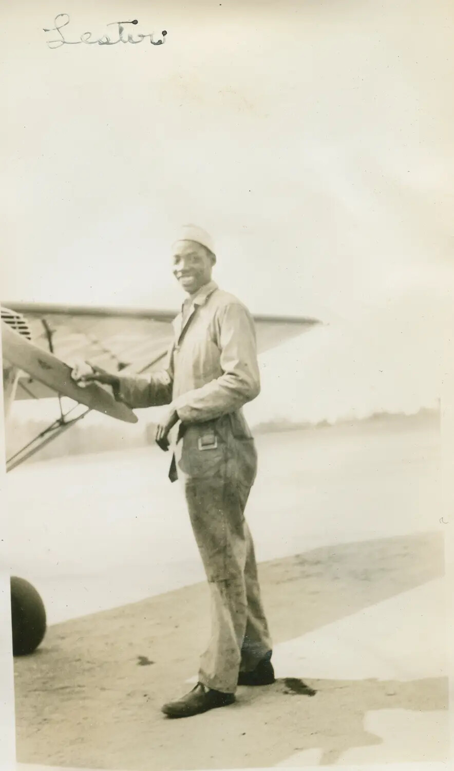 Portrait of 'Lester' Beside a Light Monoplane Wing, c. 1930s