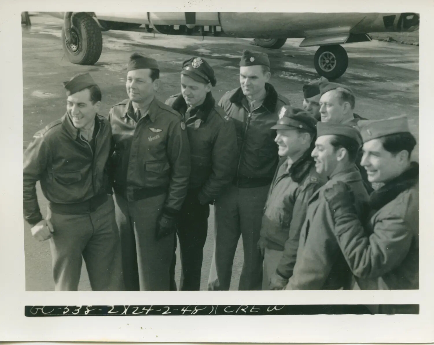 Bomber Crew Group Portrait Beneath Aircraft Landing Gear, 579th Bombardment Squadron