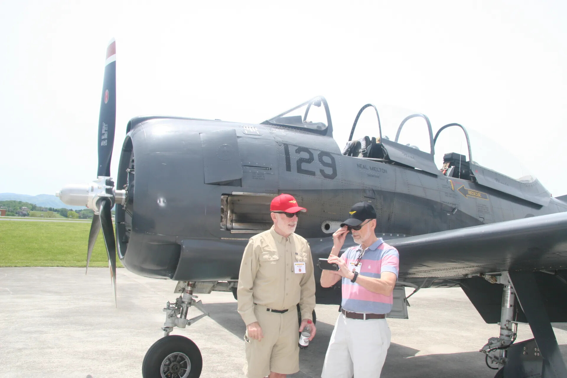 Warbird Marked 'Neal Melton' with Two Attendees — 2016 Tailwind Event