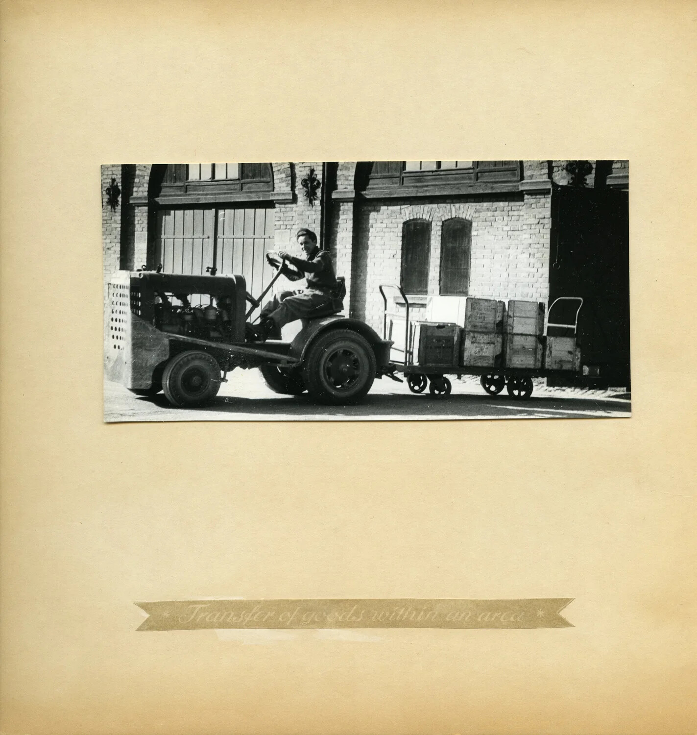 Motorized Tow Tractor Hauling Cargo Carts, Internal Goods Transfer, Depot Album Plate