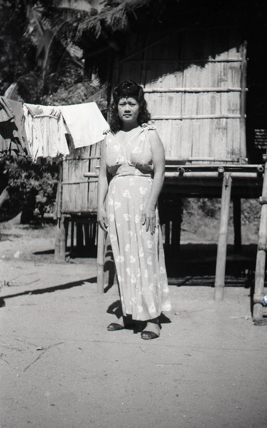 Portrait of a Young Filipina Woman Outside a Bamboo House, Luzon, Philippines, WWII