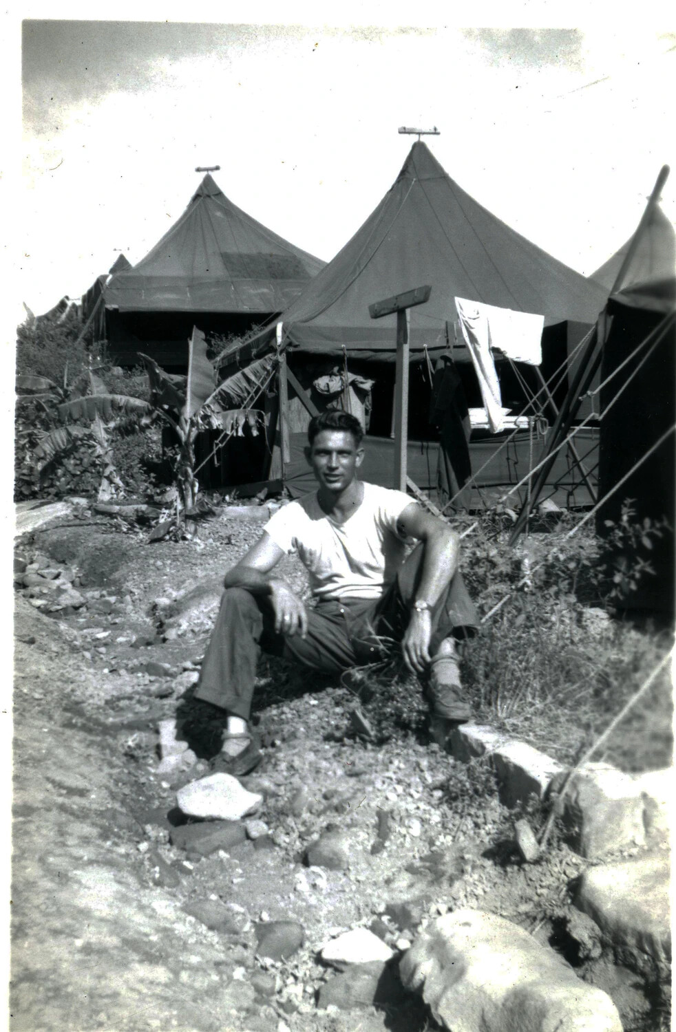 U.S. Marine Seated Before Pyramidal Tents in Tropical Camp, 5th Marine Division Collection, 1945