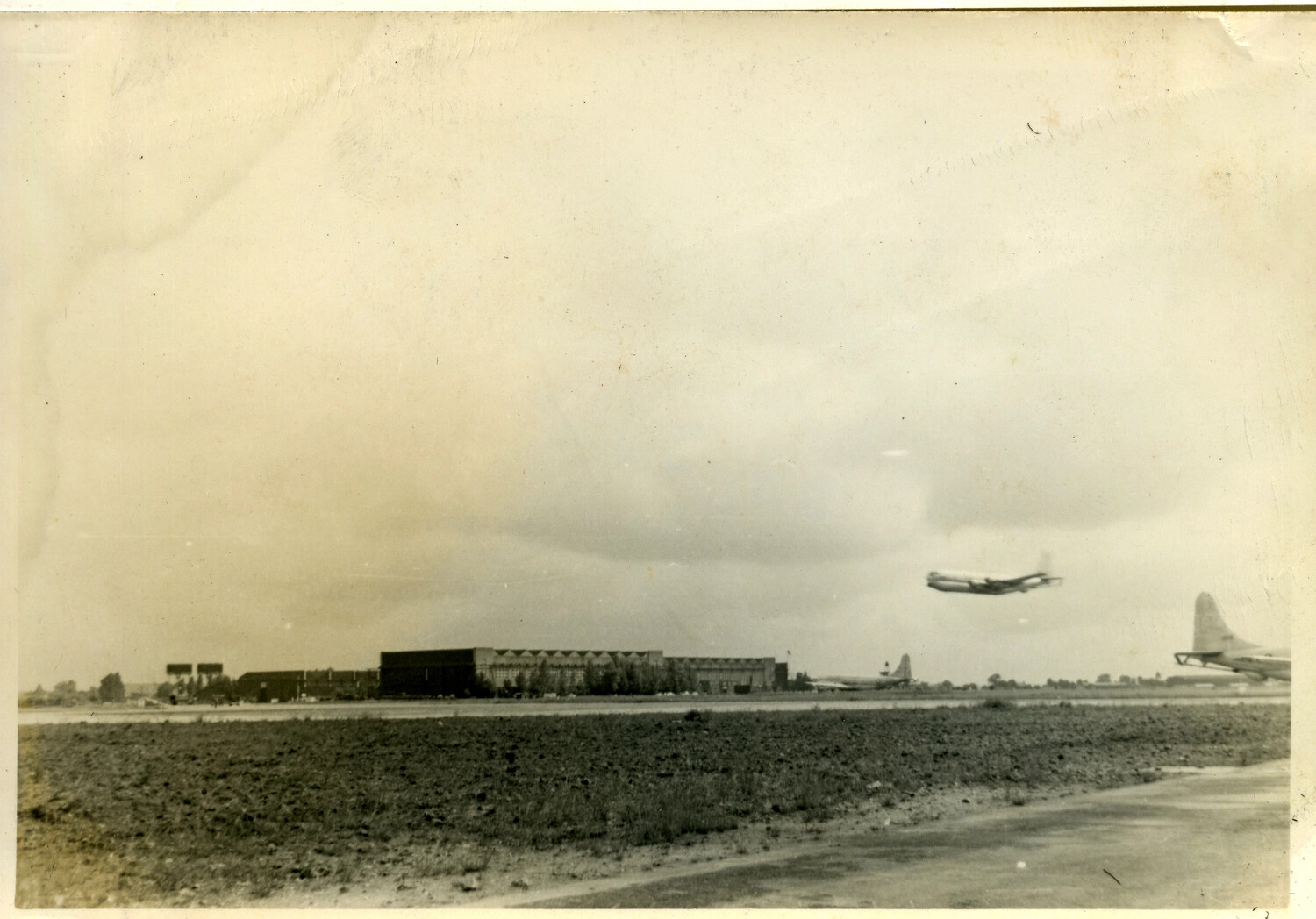 Large Transport Aircraft in Flight Over Airfield, Azores/Hickam/England Series
