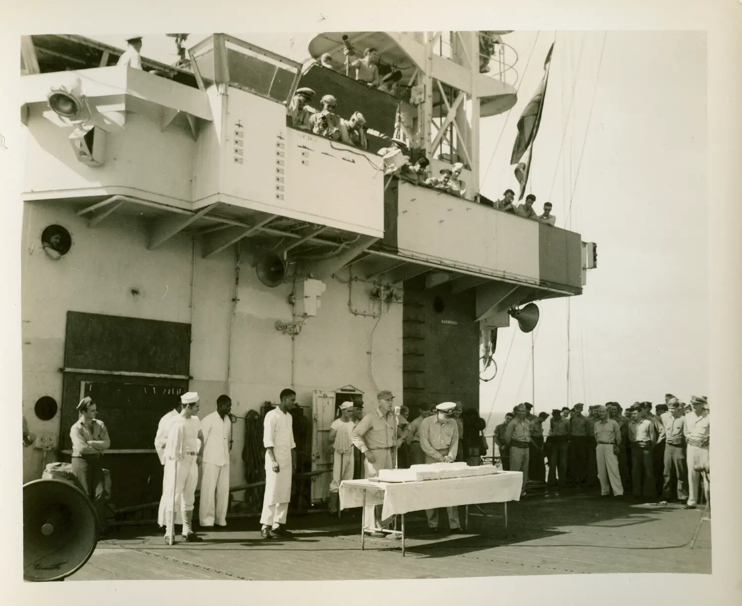 Cake-Cutting Ceremony on Flight Deck Beneath the Island, USS Petrof Bay (CVE-80), WWII