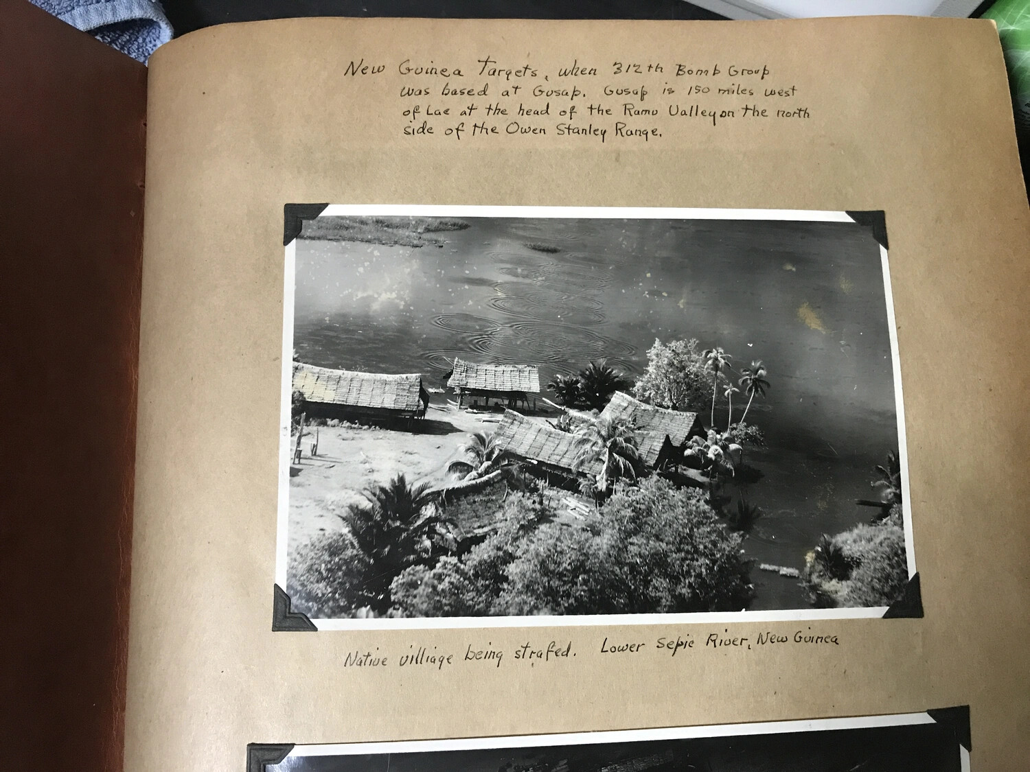 Album Page: '312th Bomb Group Based at Gusap' — Native Village Being Strafed, Lower Sepik River