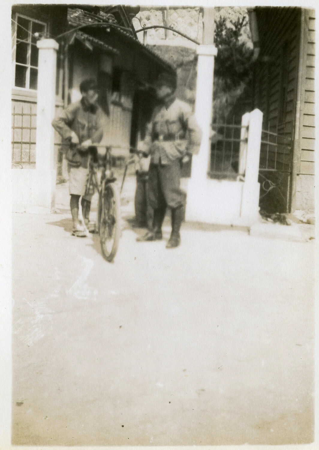 Two Japanese Men with Bicycle at Residential Gateway, Occupied Japan, circa 1945-1946