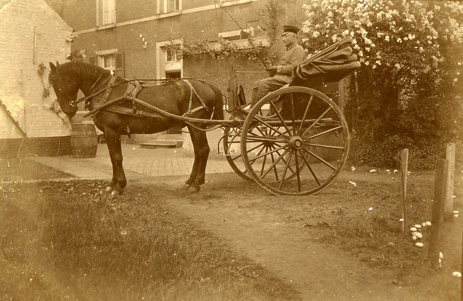 German Soldier Driving a Horse-Drawn Cart at a Rural Farmhouse, World War I