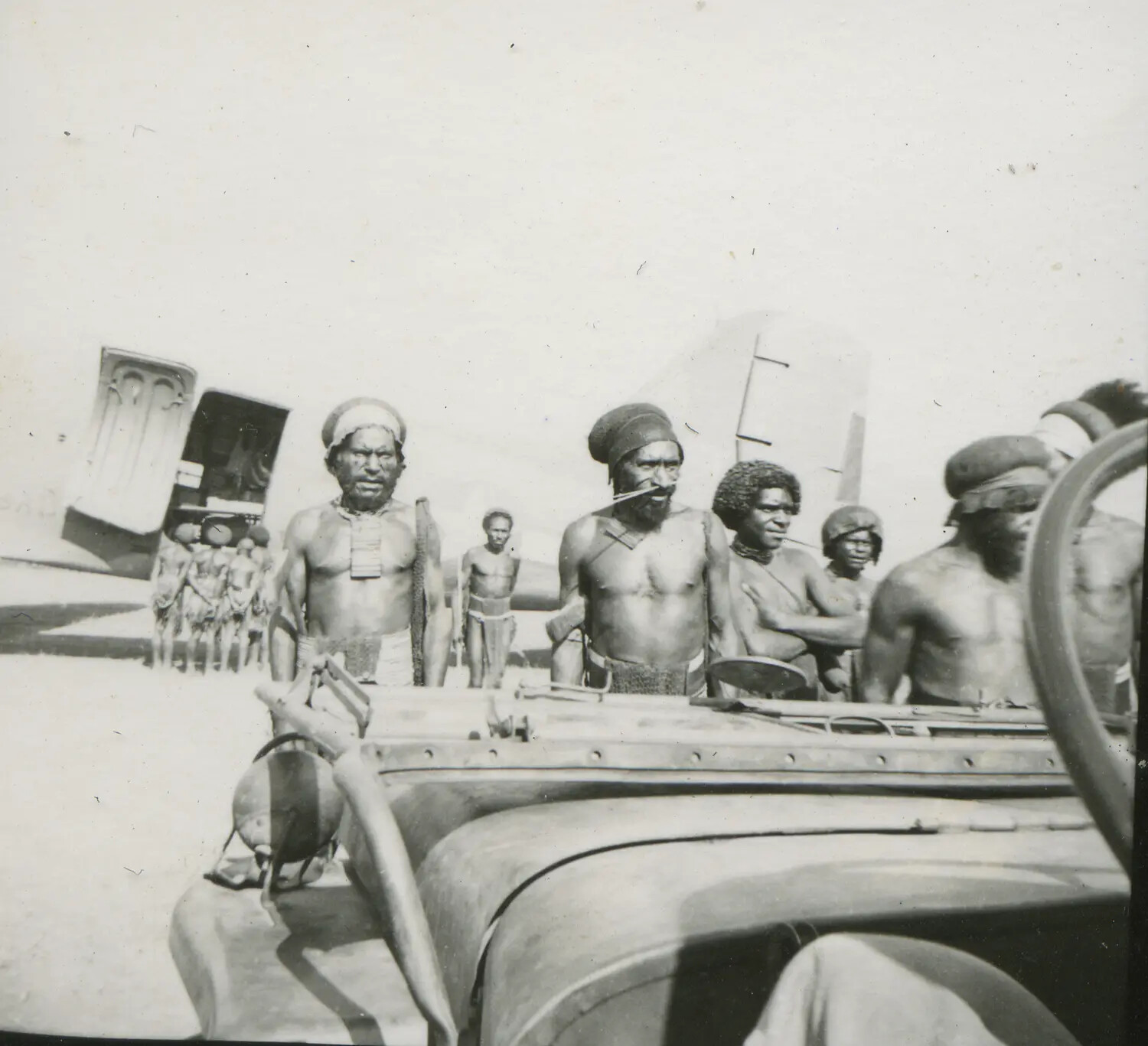 Local New Guinean Men at U.S. Airfield, Southwest Pacific Area, World War II Era
