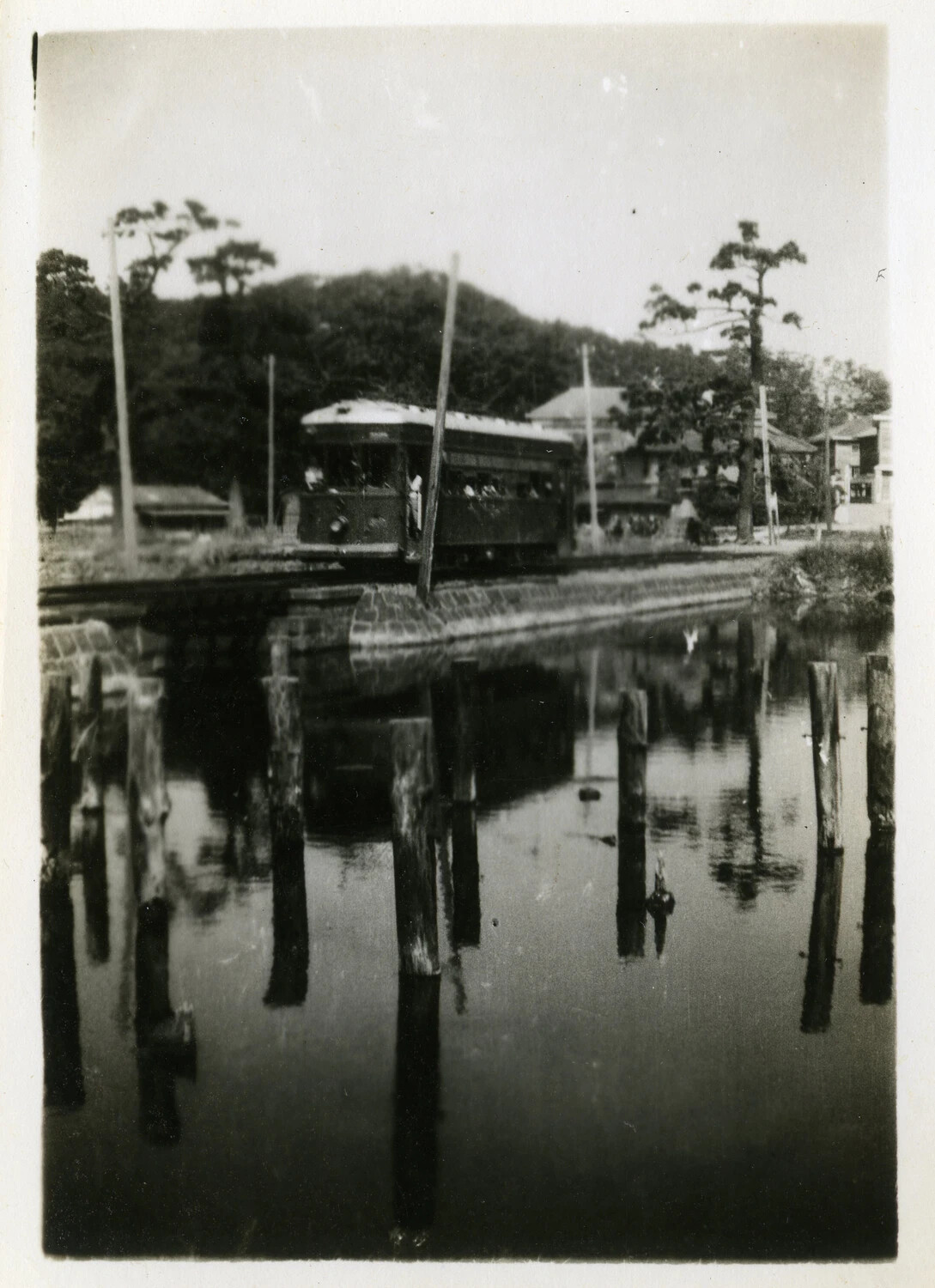 Streetcar Crossing a Canal Bridge in Occupied Japan