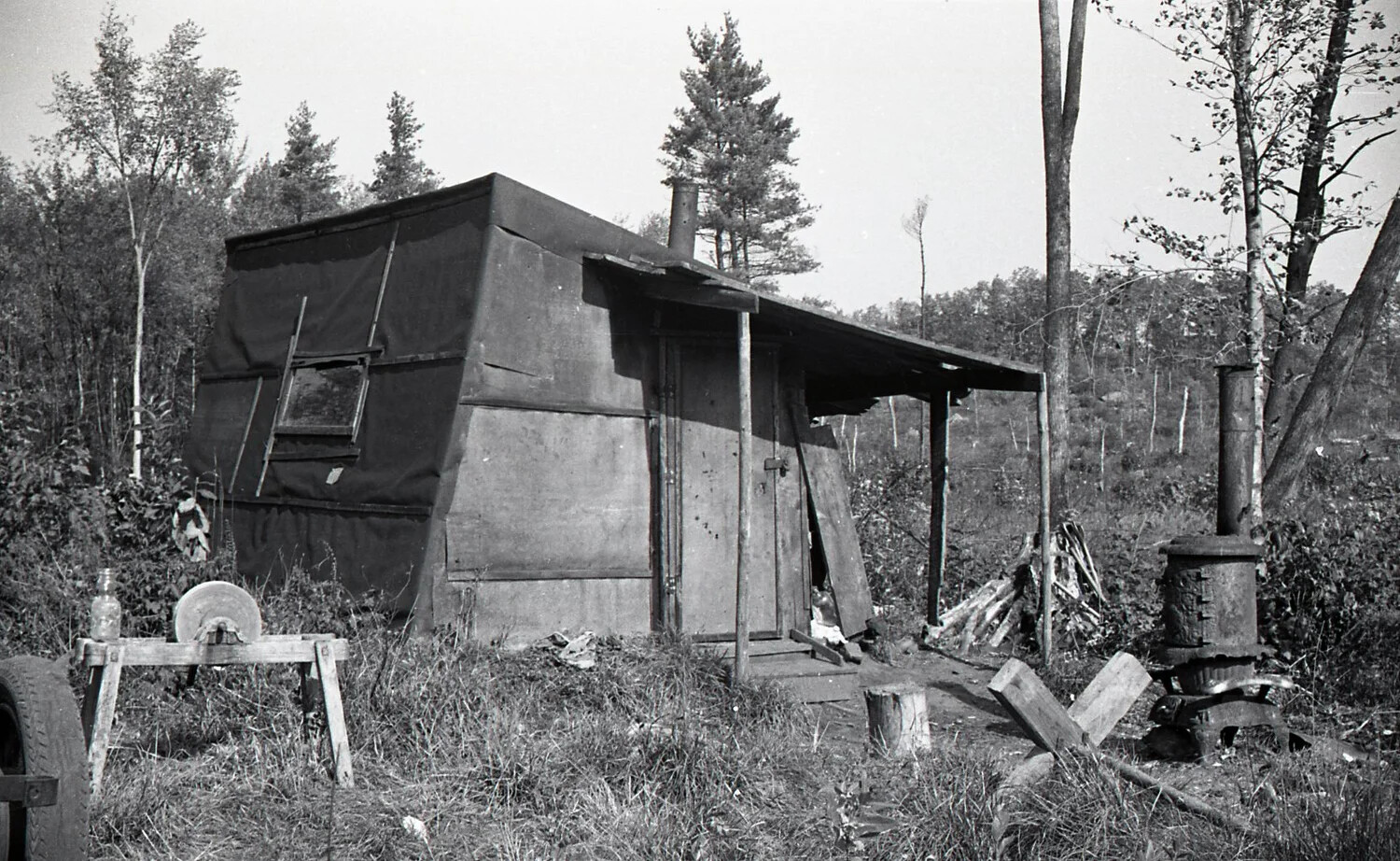 Canvas-Sided Camp Cabin with Tools and Wood Stove, c. 1940s