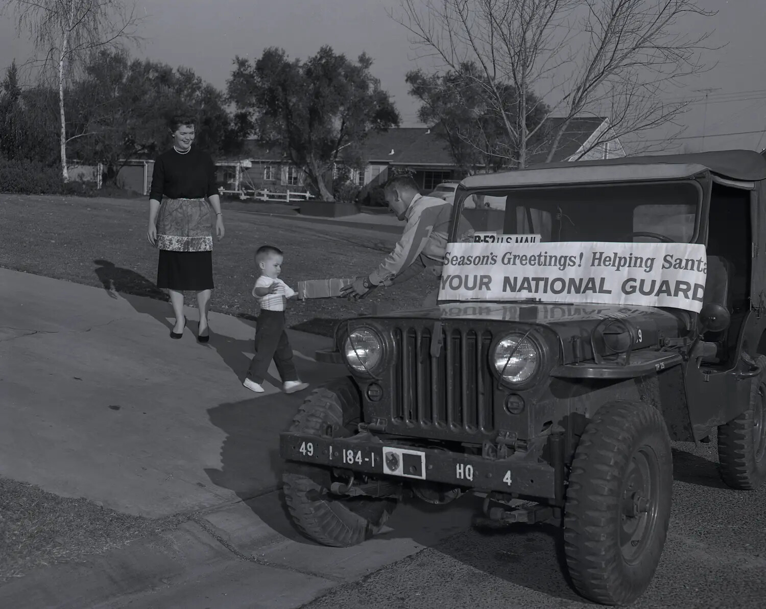National Guard M38A1 Jeep Christmas Toy Delivery, Suburban Residence, c. late 1950s