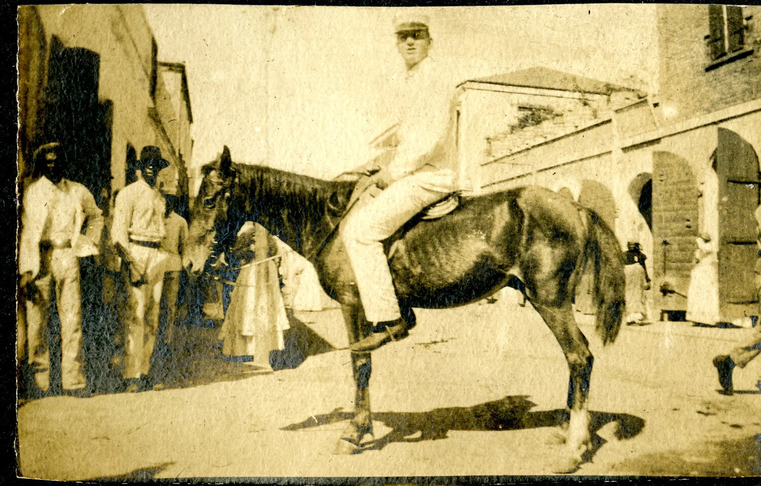 Sailor on Horseback in Foreign Port Town, USS Columbia Album, c. 1900s