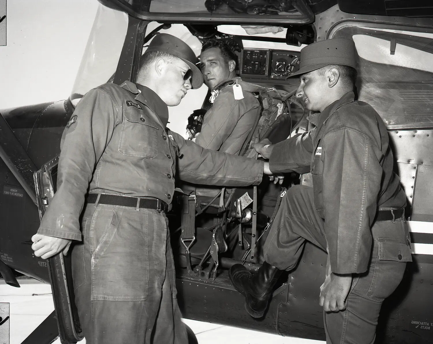 California Army National Guard Crewmen Assisting Pilot into Bell H-13-G Cockpit (Alternate Angle)