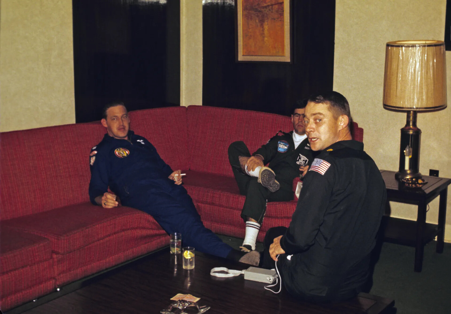 Informal Gathering of Men in Flight Suits, Hotel Lounge Setting — Don Engebretsen Collection