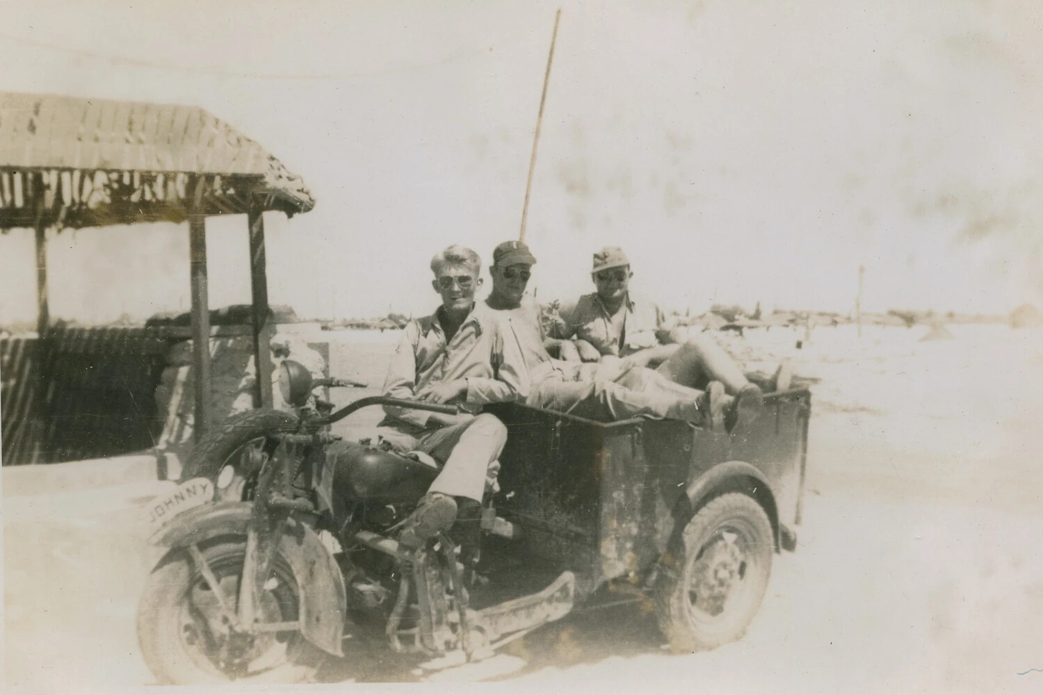 Servicemen on Named Motor Trike 'Johnny' at Pacific Island Base, Pat McAleer WWII Collection